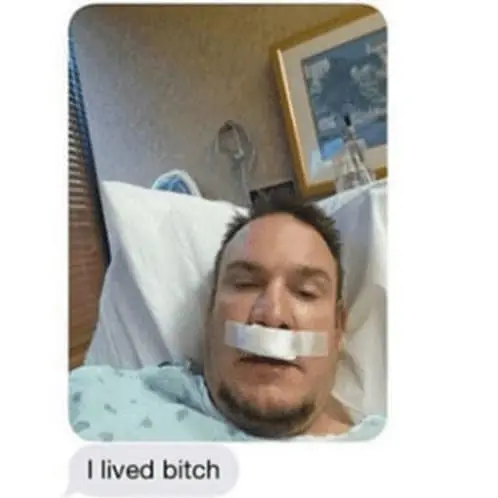 a message that reads "I lived bitch" with an image attached of a guy in a hospital bed